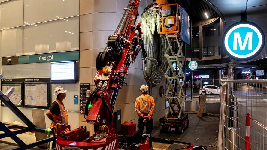 Metro art being installed at Gadigal Station